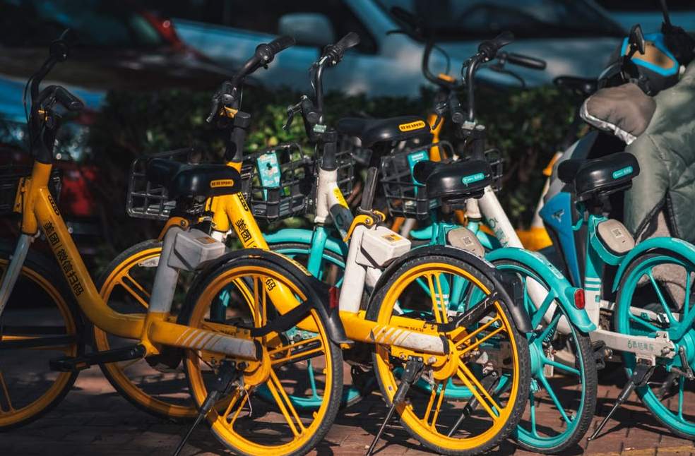 Brightly colored bikes parked in an urban area