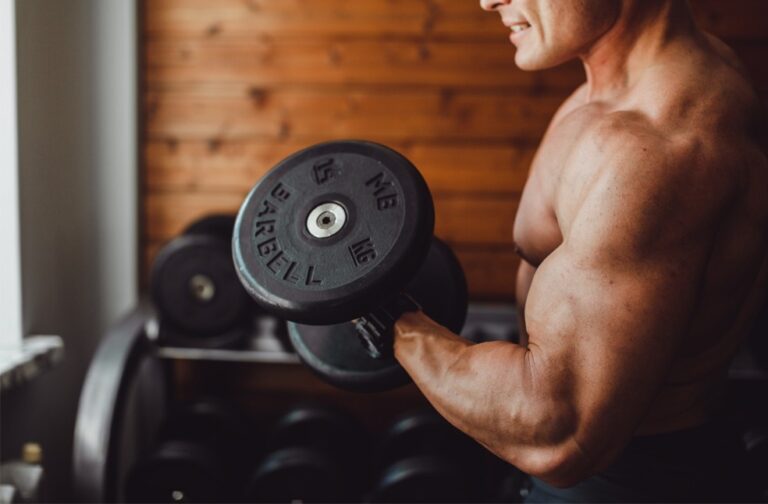 Stop Exercising? Here’s what happens to muscle and fat A man showing muscles during exercise
