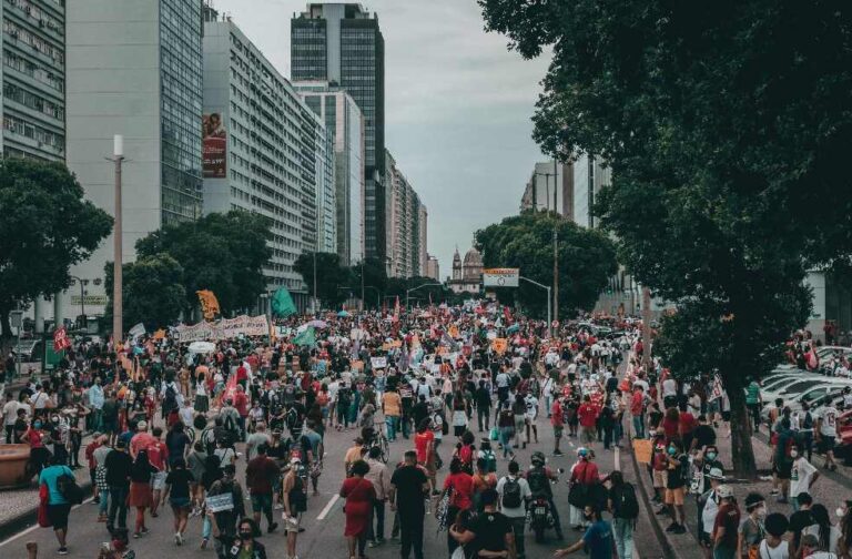 Spain housing crisis drives protests across 50 major cities A large street protest with diverse crowd in Rio de Janeiro